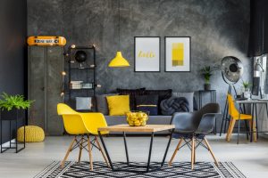 Modern furniture in unique yellow and gray industrial office interior