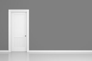 3D render of a grey wall and a door in an empty flat with space for your content
